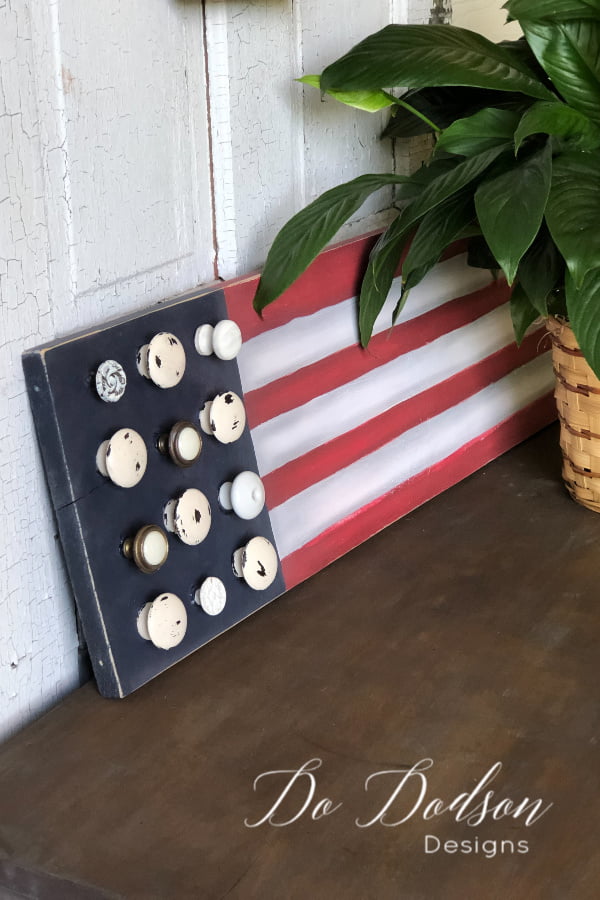 Wooden American Flag sign made from repurposed vintage knobs.