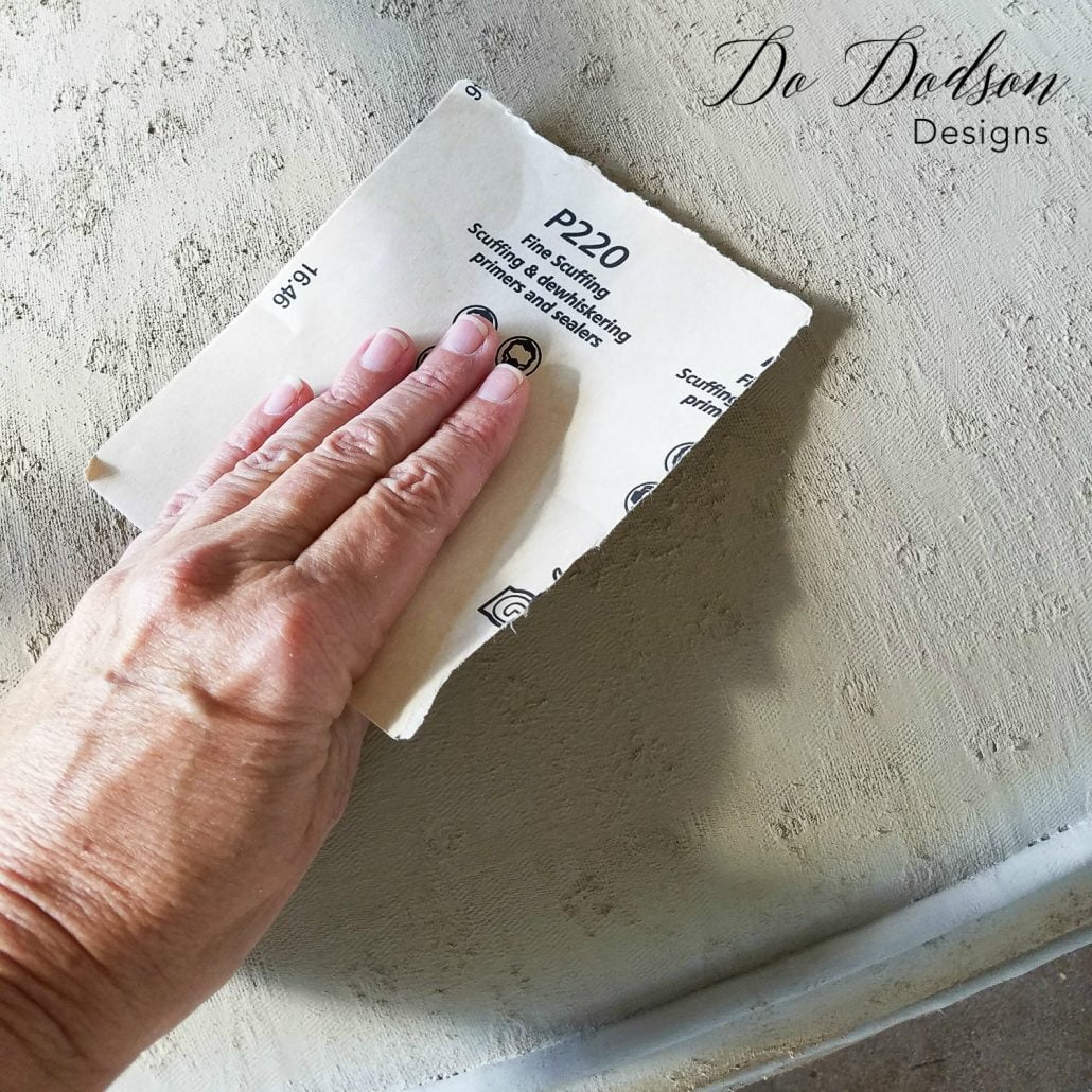 I use a 220 grit sandpaper to lightly sand over the fabric once it is dry. Yes, you can paint fabric on old chairs. #dododsondesigns #paintfabric #paintedfabric #fabricpaint #paintedfurniture