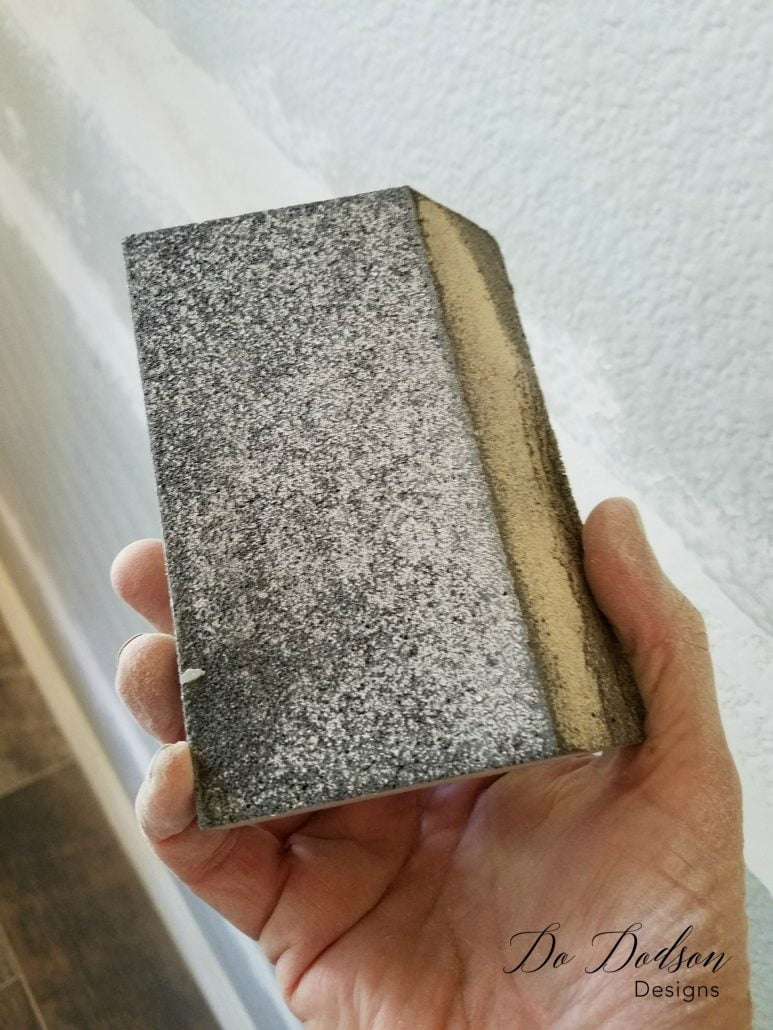 I used a sanding block to smooth the rough areas of the plaster.