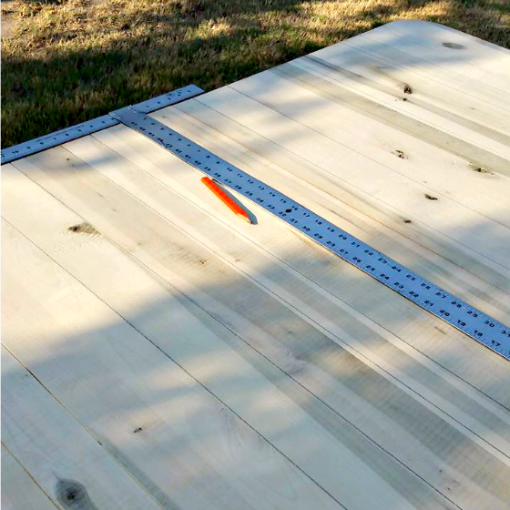 After removing all the veneer, I took my saw and cut grooves in the wood to create a faux plank table top on this farmhouse kitchen table.