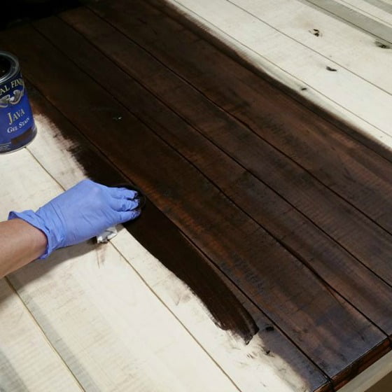 First, I stained the top of the faux plank famhouse kitchen table. Next, I'll add paint to create an aged distressed look.