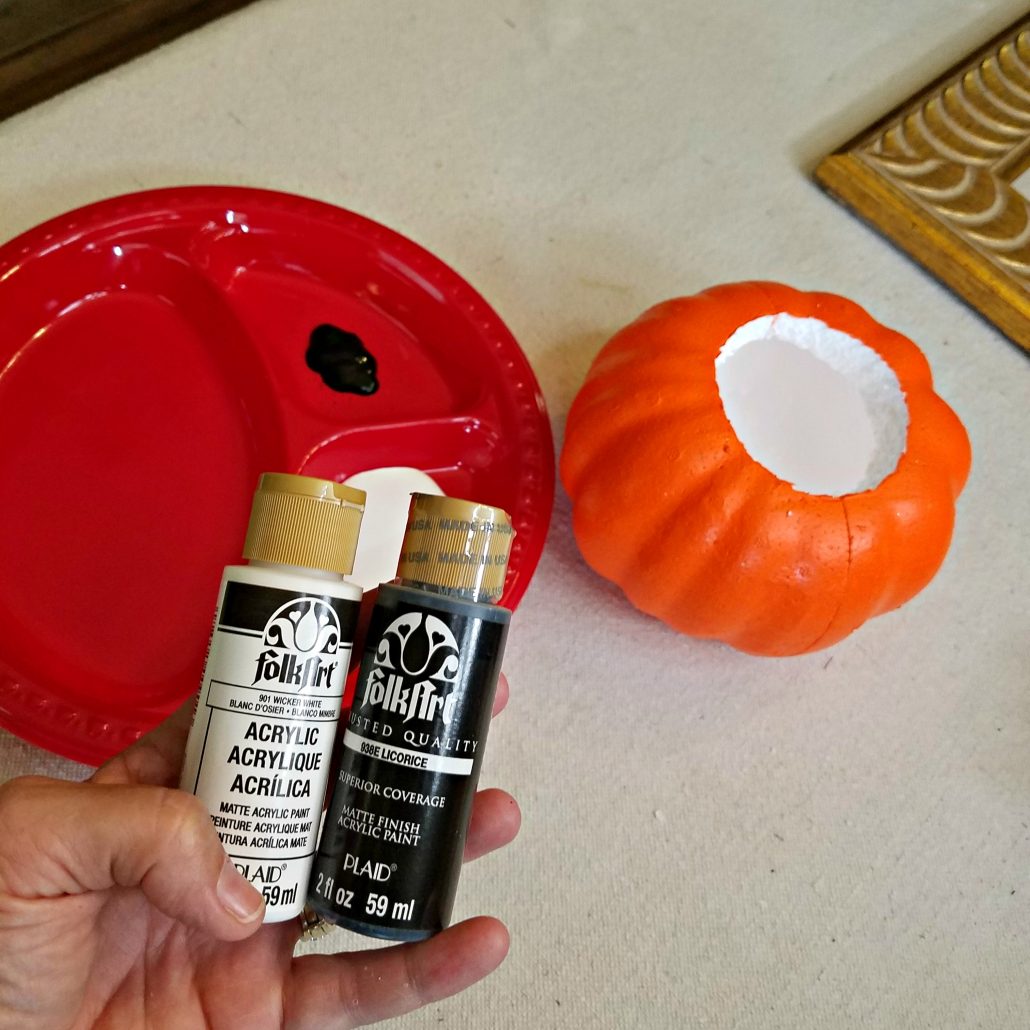 You'll need craft paints for this simple DIY Faux Concrete Pumpkin makeover.