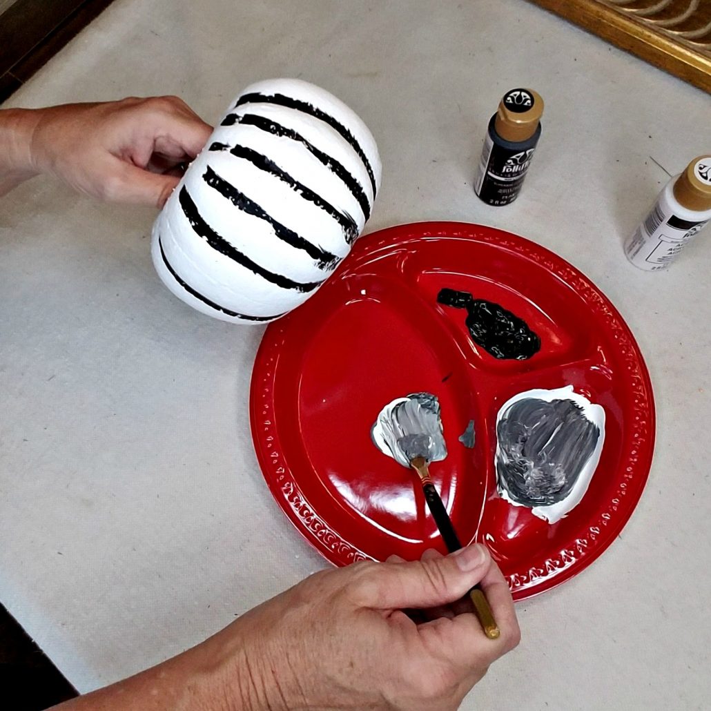 I painted the the creases with black to add depth to my faux concrete pumpkin makeover project.