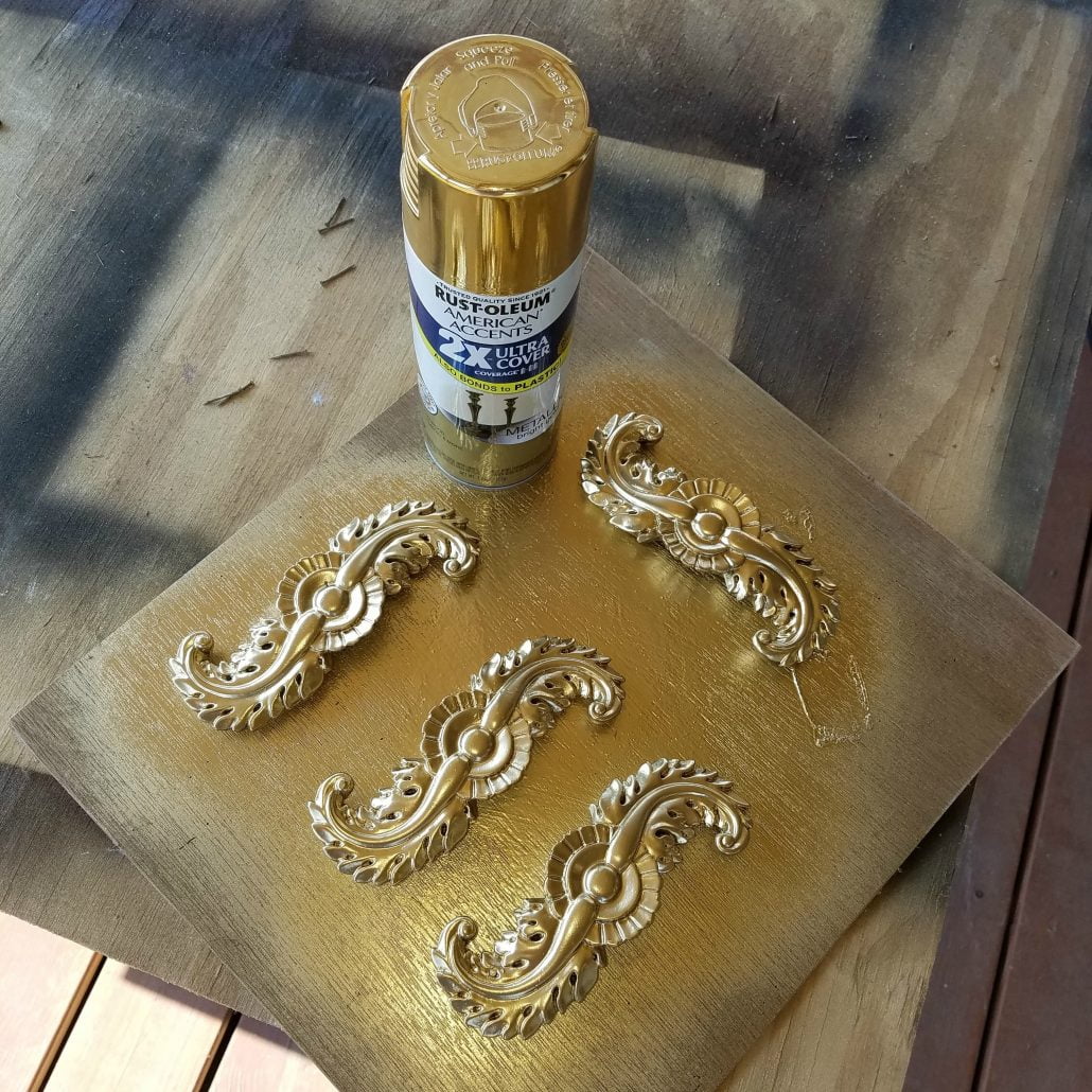 I spray painted the hardware on my side table with Gold. 