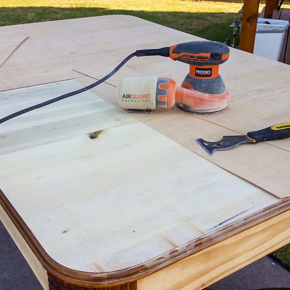 After removing all the veneer, I took my saw and cut grooves in the wood to create a faux plank table top on this farmhouse kitchen table.
