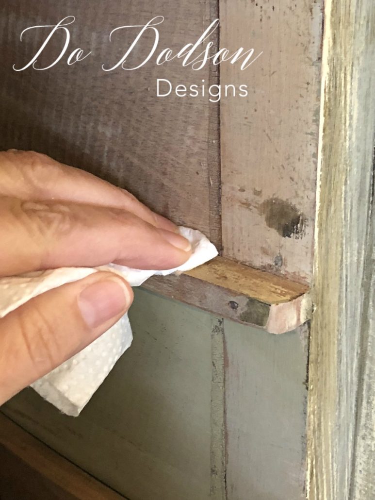 After sanding the wooden drawer slides with the sanding blocks, apply a small amount of the paste wax on a paper towel (because it's disposable and easy) and then apply it to the drawers and slides. Use long even strokes. The wax should be dried within a few minutes so you can slide your drawers back into place.