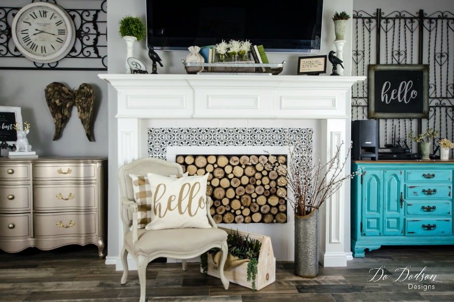 What do you think about the painted tiles? Learning to paint tiles around your fireplace is a great way to brighten up a space. 
