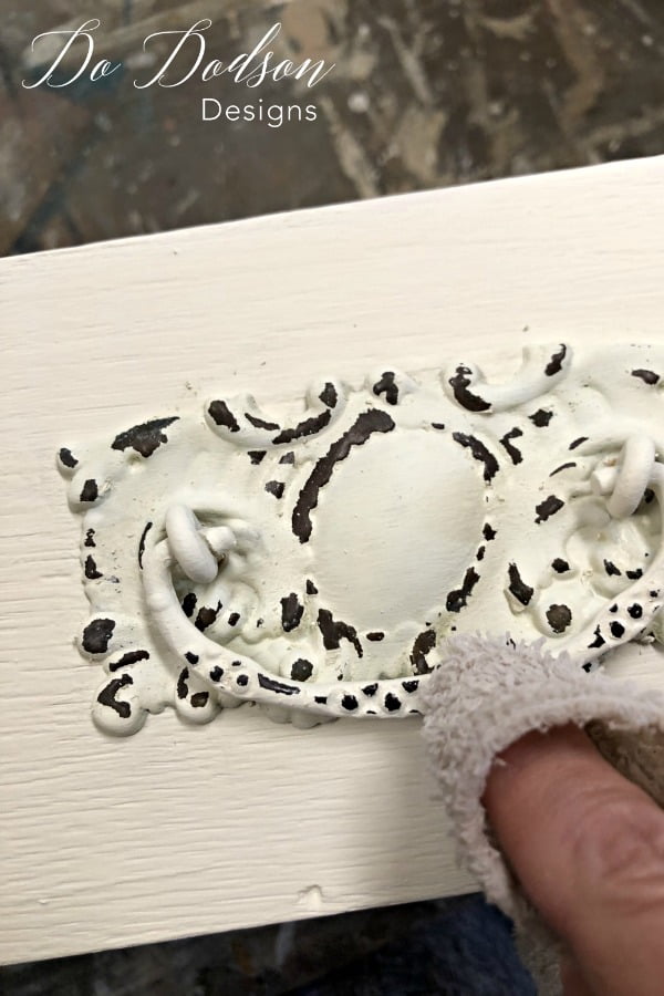 Wet distressing paint to get a chippy look is easy with painting furniture and even the hardware.