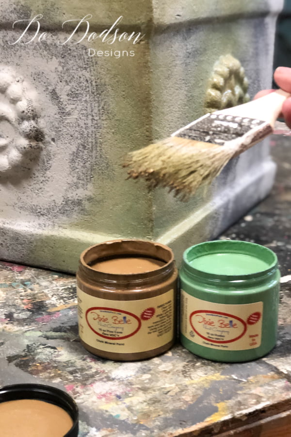 Using two colors of chalk paint I blended them together to create an aged and weathered look on these terracotta pots.