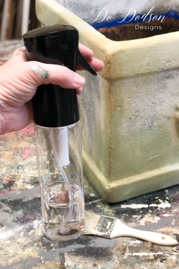 I used my fine spray mist water bottle to help blend the colors together but lightly misting over as I brushed. These painted terracotta pots look totally different. NO MORE ORANGE!