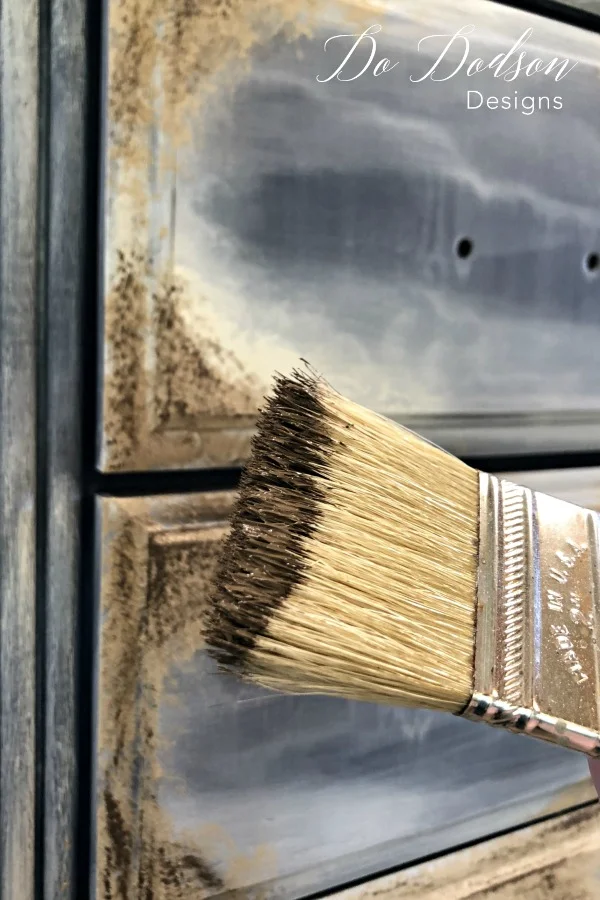 Adding a dark chocolate over the lighter color paint that added an aged and dirty look to this chest. #dododsondesigns #textured #texturepainting #paintedfurniture #furnituremakeover #furnitureartist