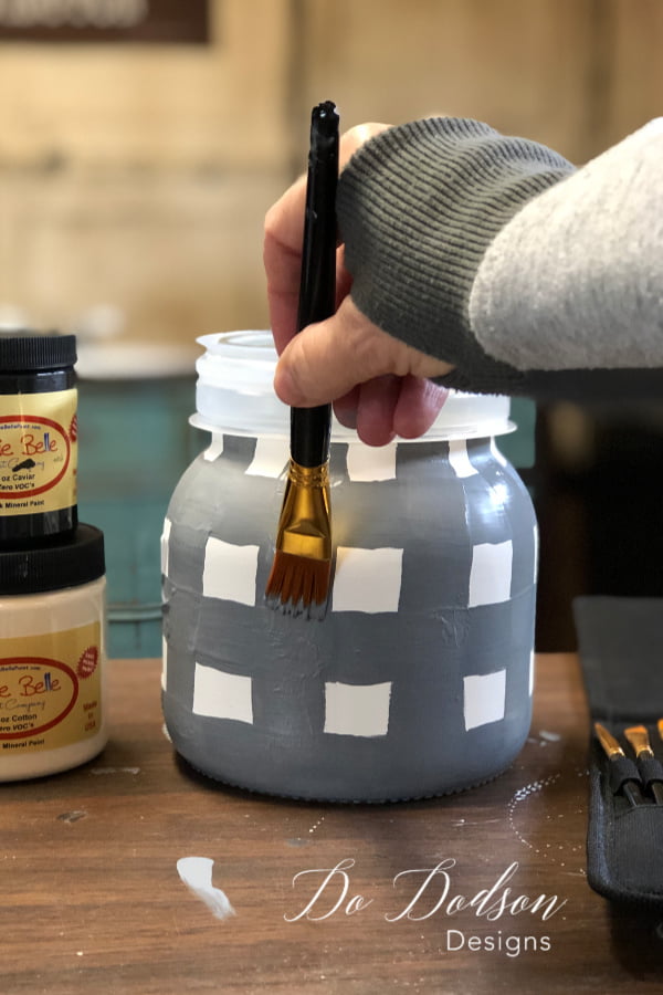 Using a 1 inch artist brush made it easier to create the buffalo plaid design on my Mason Jar.