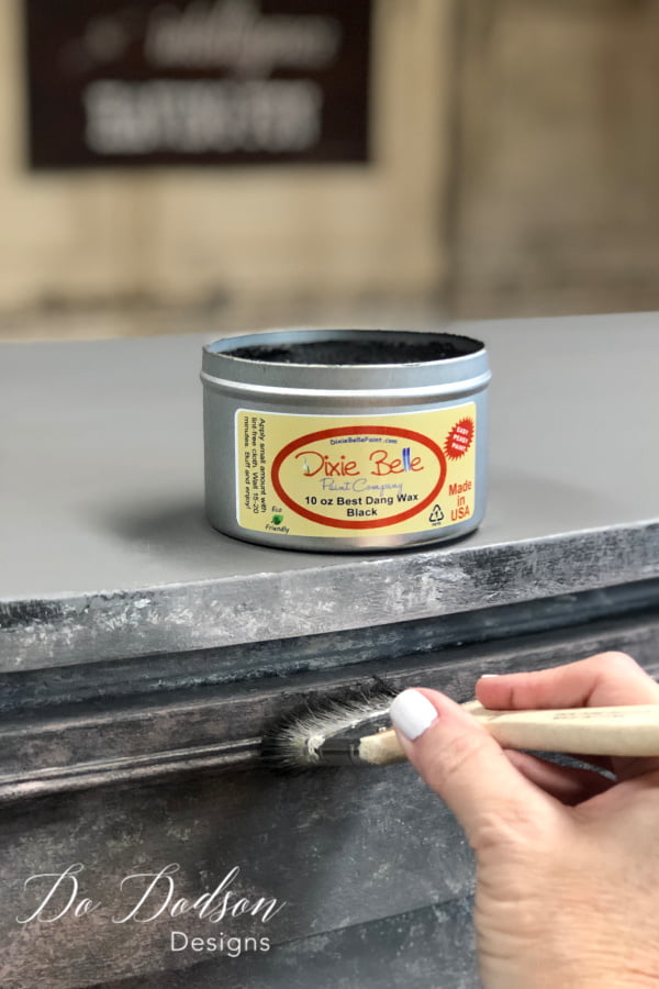 I added black wax with a chip brush to bring out the details in the layered paint finish.