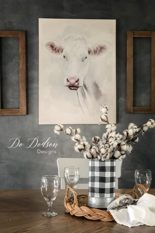 Cow art and a farm table go together like peas and carrots.