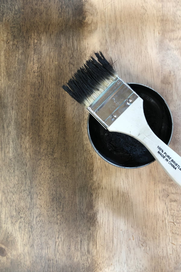 Adding black wax over raw wood on this farm table created a beautiful finish.