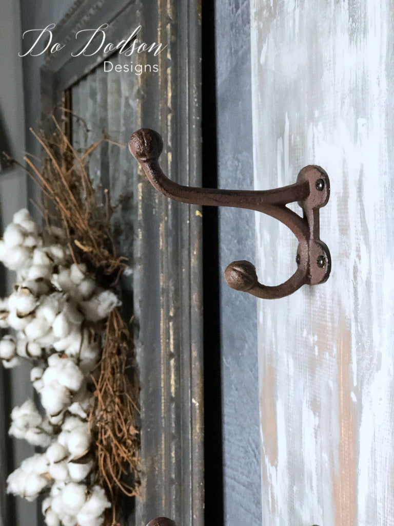 I love the look of these rustic wall coat hanger hooks with the weathered paint finish on this.