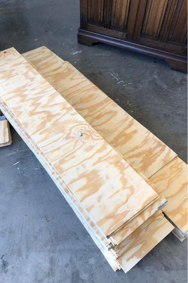 10 inch stripes of plywood make the perfect faux shiplap wall.
