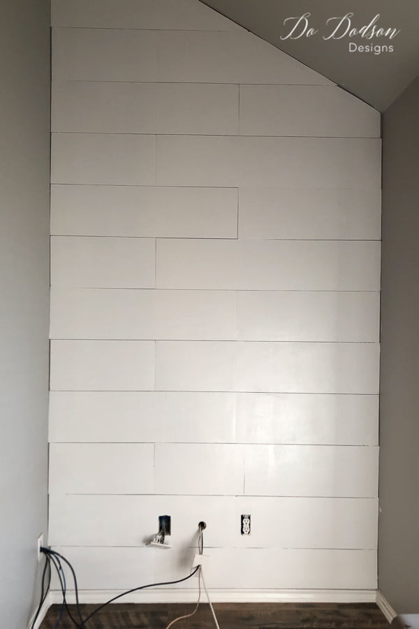 Always use a good quality flat paint when painting a faux shiplap wall made from plywood.