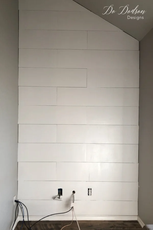 Always use a good quality flat paint when painting a faux shiplap wall made from plywood.