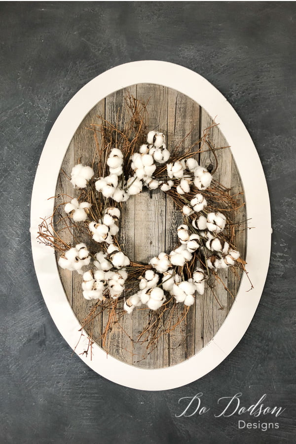 Reclaimed wood and a frame from an old mirror is all you need to create a beautiful home decor sign or use it as a place to hang your favorite wreath.