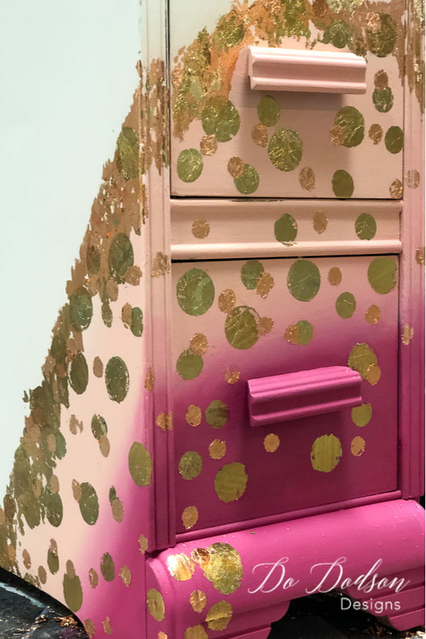 Gold and copper leaf polka dots on a pink painted nightstand.