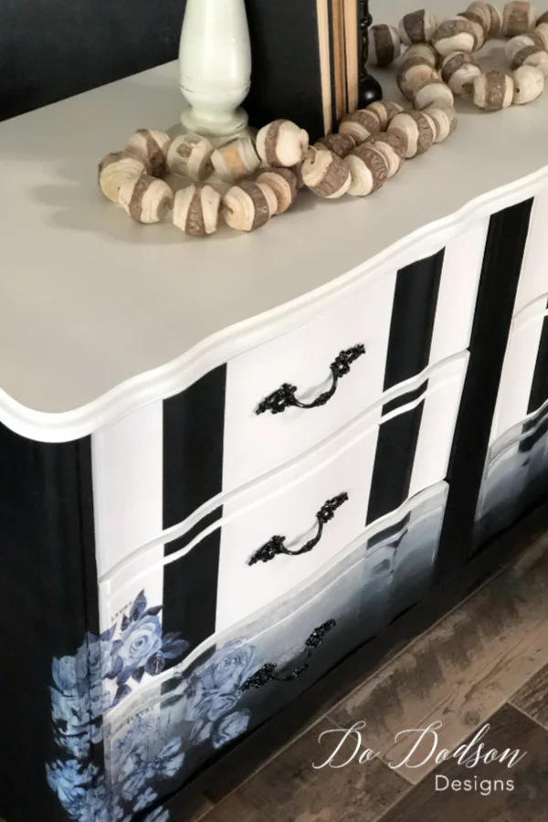I love the look of bold stripes on furniture with a floral pattern.