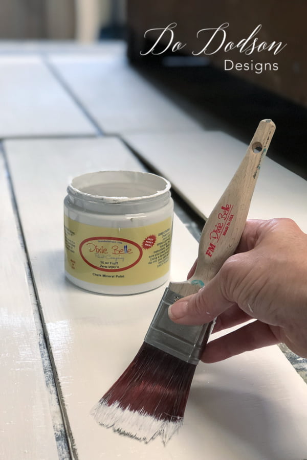 I painted the strips of plywood white to give them that authentic shiplap look to my upcycled picture frames.