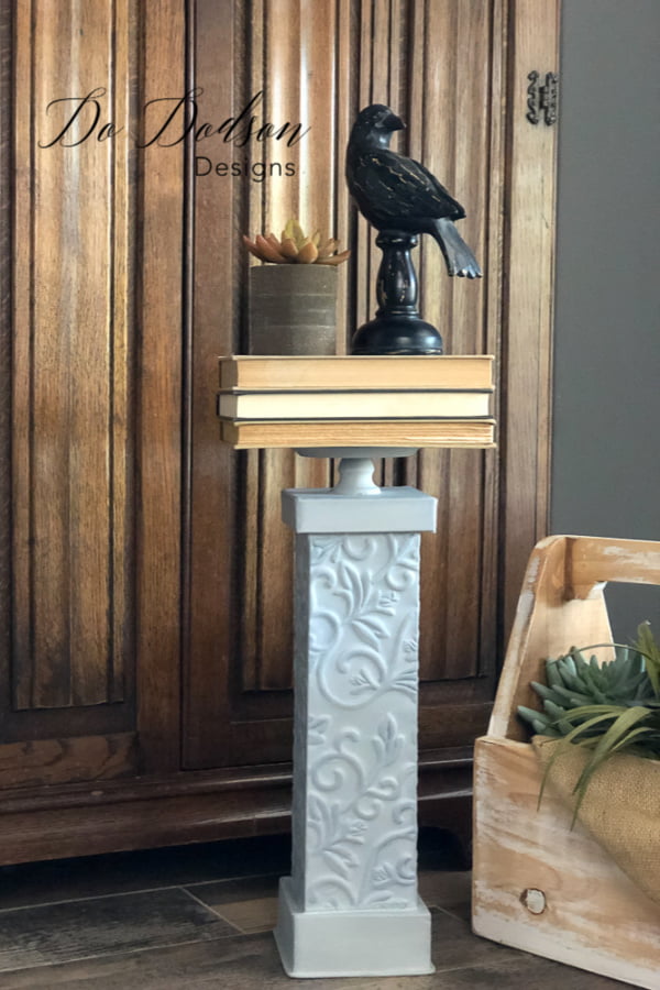 I love using upcycled home decor. Stacking books on this candle holder is a great way to add your own style.
