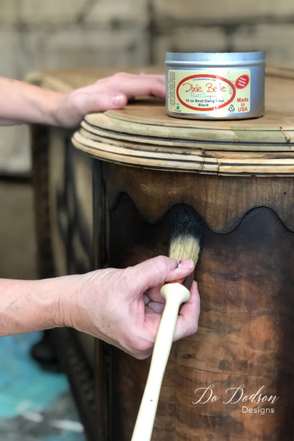 Adding black wax to the raw wood will compliment the beauty of the bare wood and seal it for protection. No paint needed on this one.