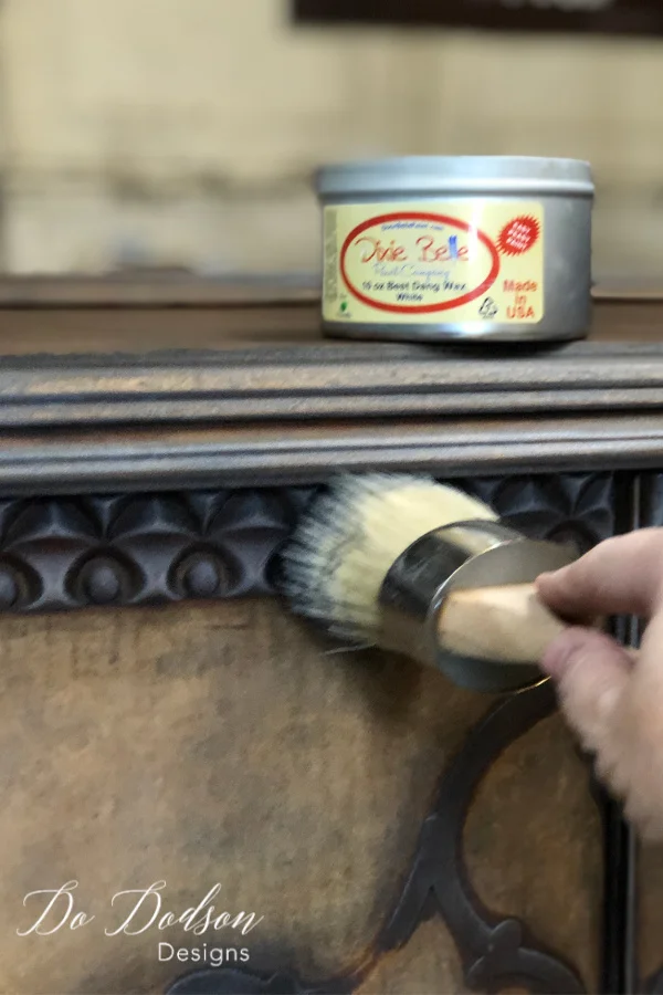 After adding the black wax, I used a white wax to add highlights to the wood on this old table.
