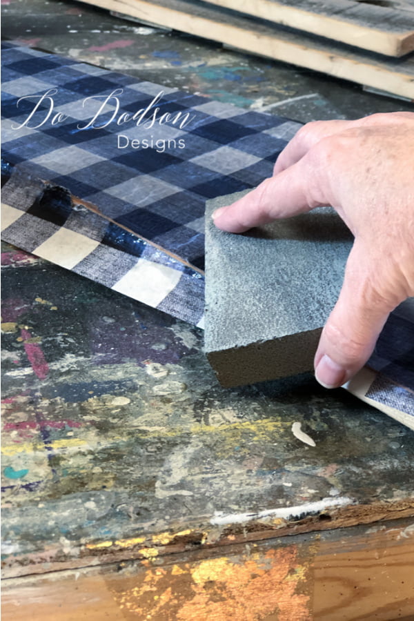 While the topcoat is still wet, I use a sanding block to gently rub the side to cut the tissue paper perfectly.
