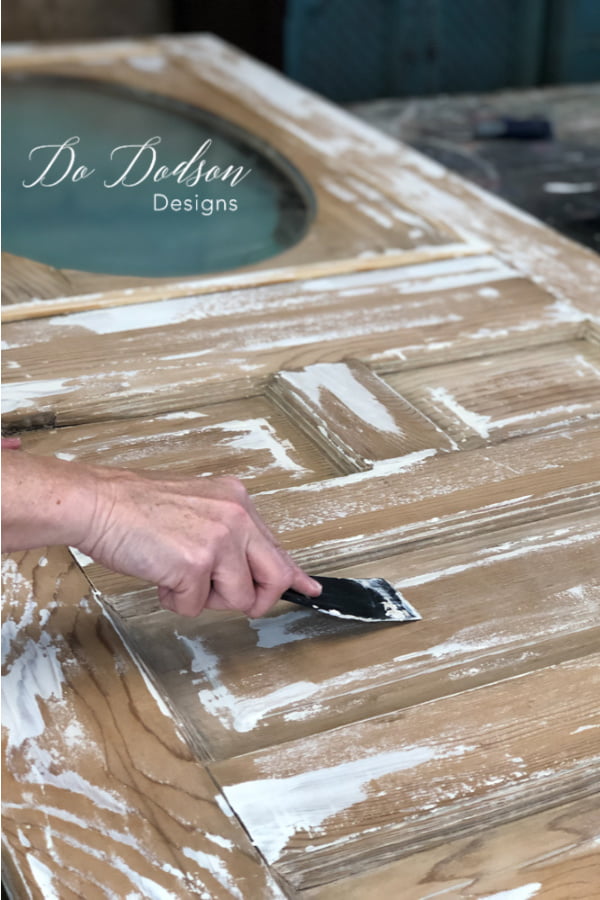 To add a chippy paint technique I used a plastic applicator to drap paint across the surface of the vintage door.