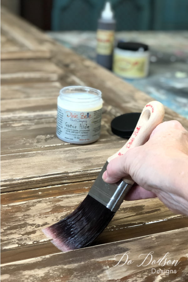 After adding the chippy paint technique on the vintage door, it was sealed with Gator Hide.