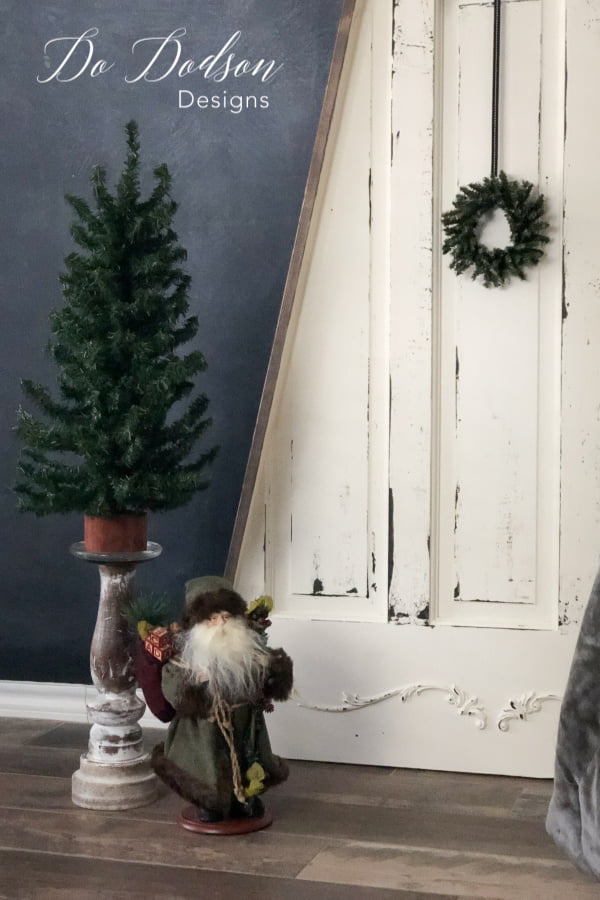 This was the best use of an old door! I cut it into the shape of a Christmas tree! It's perfect for small spaces.