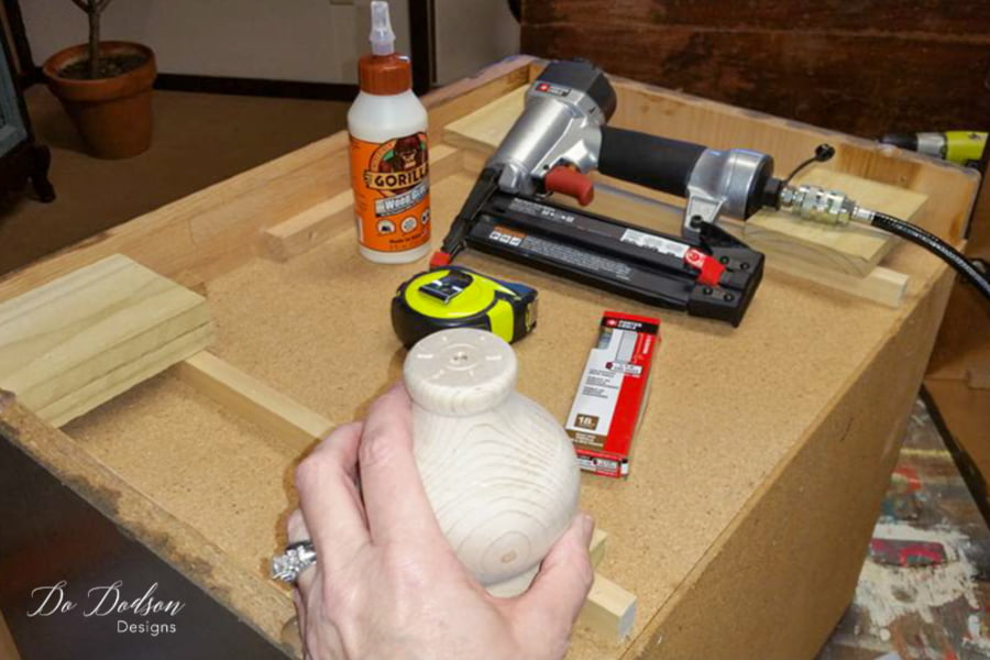 For this style of wood leg, you will need to secure the bolt hangers inside the legs. These wood legs did not come with screws, but some do.