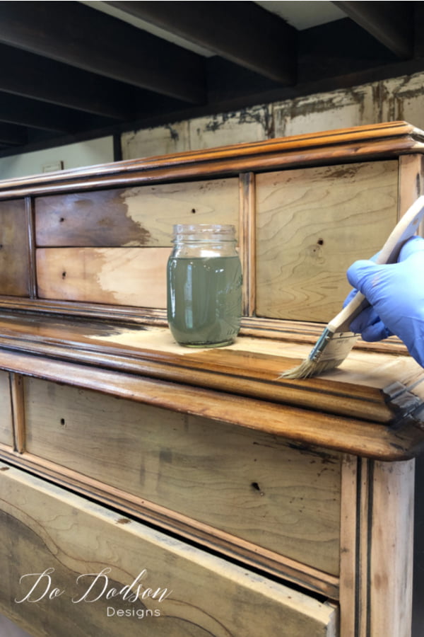 Before applying the vinegar and steel wool solution to the wood, remove the steel wool from the jar and dispose of it. This is the beginning of your restoration hardware finish on wood furniture. 