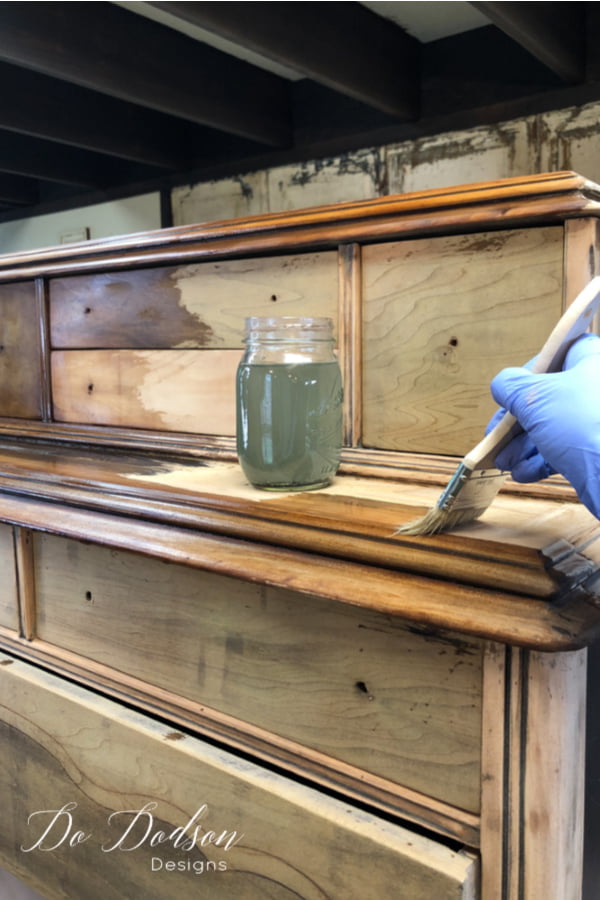 Before applying the vinegar and steel wool solution to the wood, remove the steel wool from the jar and dispose of it. This is the beginning of your restoration hardware finish on wood furniture.