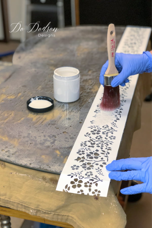 Before painting the back of the antique mirror, try adding a stencil. This can add a personalized touch and BONUS... if your mirror makeover is going to be an addition to another piece of furniture, you can customize the look for a great match.