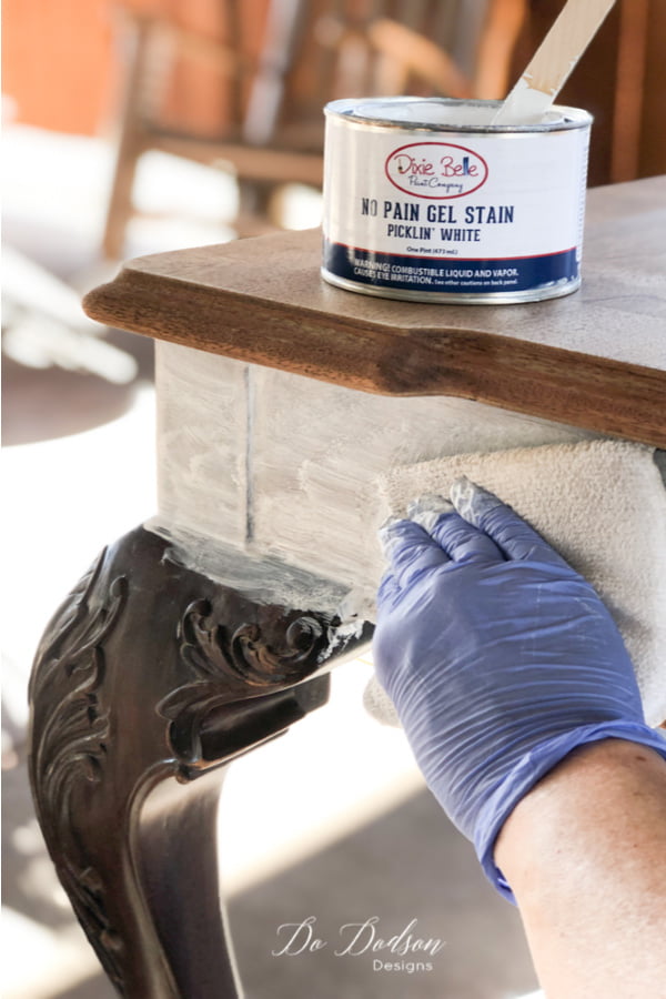 Now the easy part! Apply the whitewash pickling stain over the raw clean wood with a staining pad and wipe back any remaining stain with a soft cloth. The whitewash wood on this table top is going to look amazing!