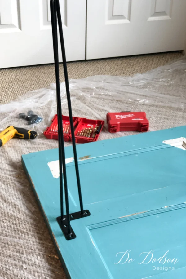 Adding hairpin legs to this old door will turn it into the perfect DIY desk.