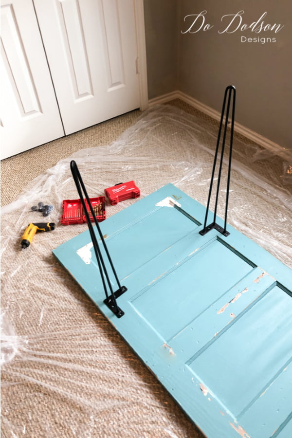 When adding hairpin legs you'll need to measure and space them out properly. This will distribute the weight of the DIY desk to support it properly.