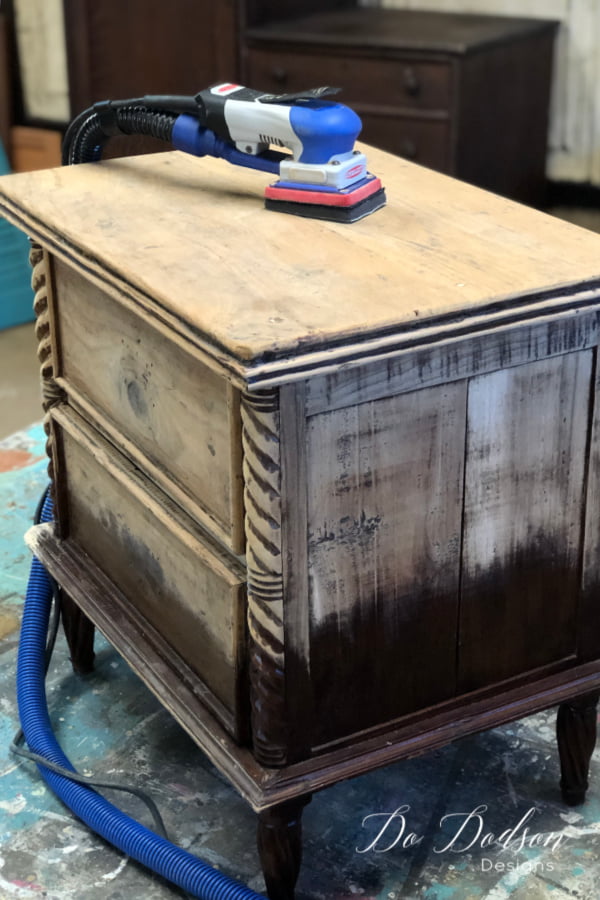 I usually start with an 80 grit paper and if that doesn't cut through quickly, I step it up to the 60 grit. This side table was stripped in about 15 minutes with my SurfPrep Sanding System to get this raw wood look on wood furniture.