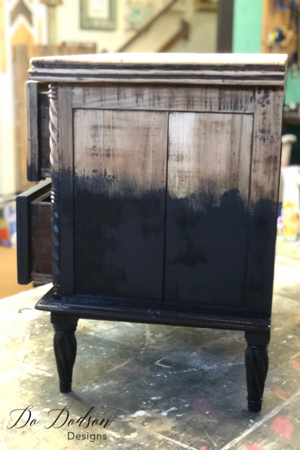 Using a paintbrush, I started by painting up into the raw wood and stopped where I wanted to blend the paint into the wood.
