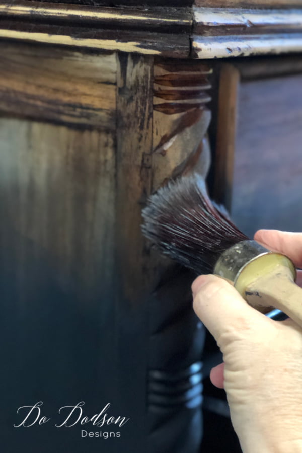 Next, apply the same color of paint (Caviar) right below the raw wood are where the paint meets the raw wood. Then use your water mist bottle to dampen the raw wood while pulling the wet paint up into the wood. The water will help dilute the paint and aid in the blending of the paint on the damp wood.