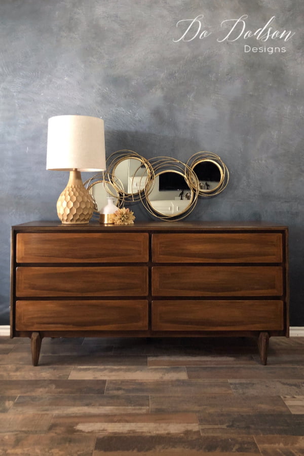 Mid Century Modern Dresser refinished with dark walnut gel stain. Get the DIY tutorial now!