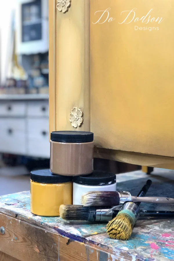 Chose 2-3 colors that are complementary to each other. For example... for this piece I chose Colonel Mustard (yellow), Pine Cone (brown), and Butter Cream (off white). Blending chalk paint is much easier when the colors are cohesive. One-color blends into the other creating a third color and you can really create some amazing finishes when colors collide.