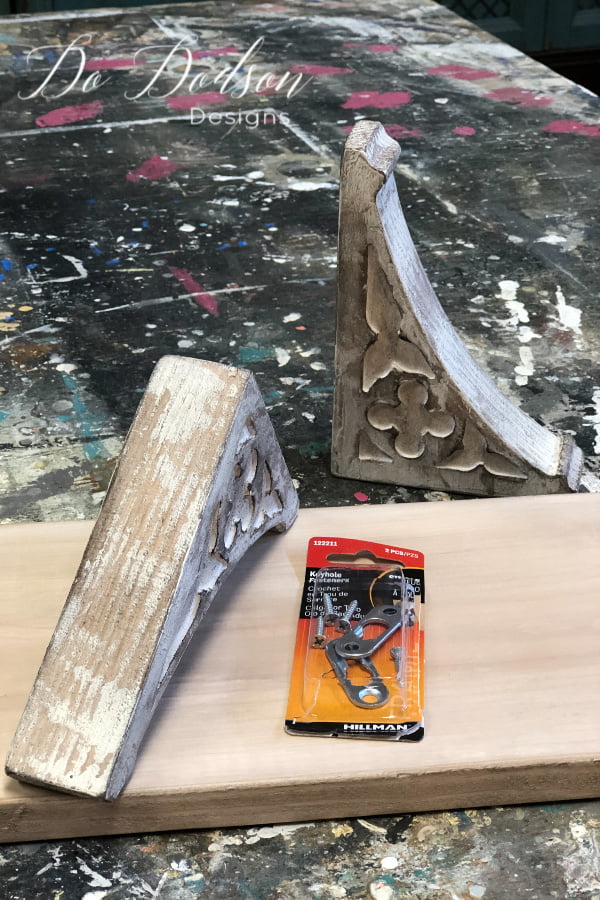 It took me a while to find hangers for the corbels but these were the easiest that I found for a beginner. Some of the hardware required drilling holes and all that nonsense. I wanted quick and easy so here it is. Keyhole fasteners! Most hardware stores carry these and I only used one per corbel since they were so small.