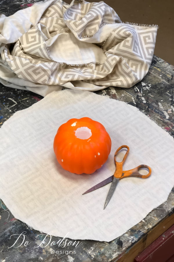 Once you have cut your fabric, round off the corners so that the fabric fits nicely inside the hole.