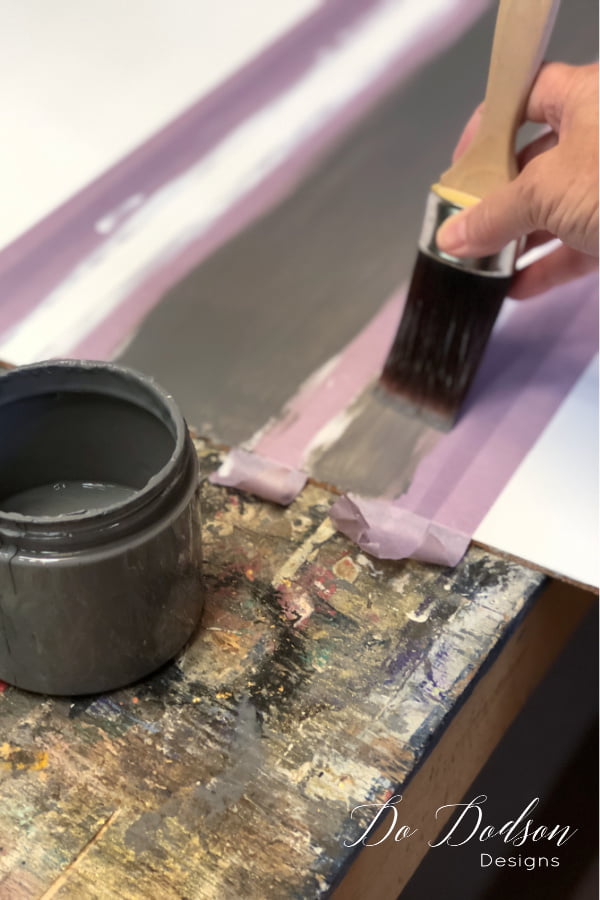 With your paintbrush, paint the accent color inside the taped off area.