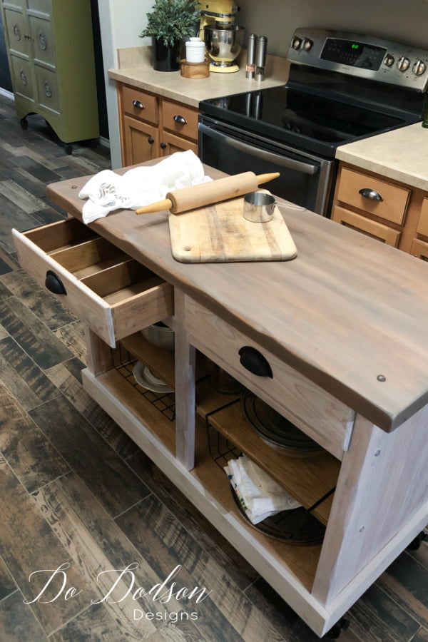Small kitchen do create a problem when it comes to counter space. I made this DIY rolling kitchen island out of an old cabinet. It was the perfect solution.